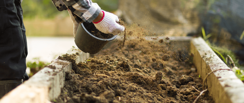 bucket scooping soil
